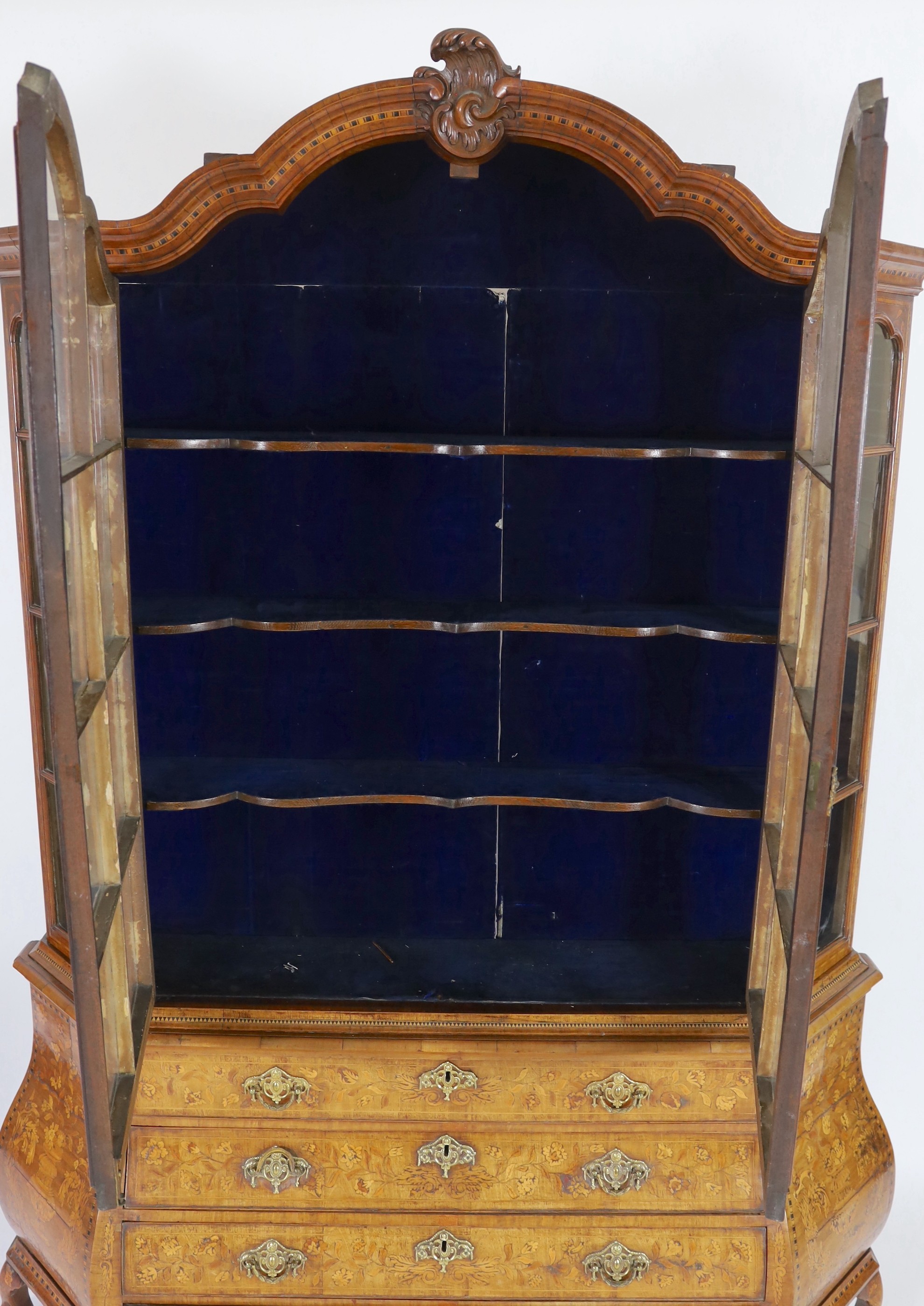 A 19th-century Dutch marquetry and walnut display cabinet Width 178cm. Height 240cm. Depth 36cm.